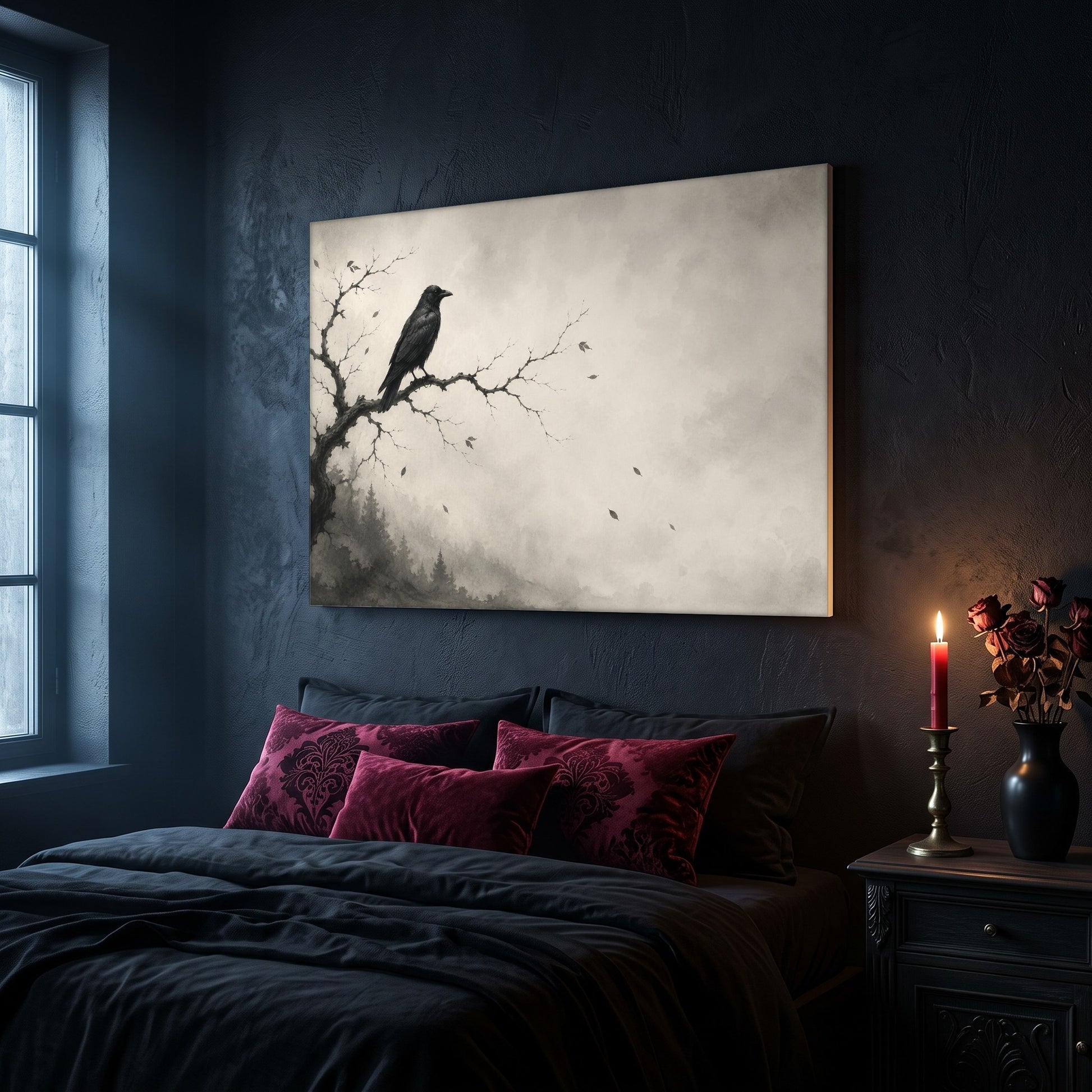 Hollow Morning crow canvas hanging on a dark navy wall above a bed in a gothic bedroom, with magenta and burgundy damask velvet cushions against dark bedding, a tall window to the left, and a nightstand holding a lit red taper candle in a brass holder and a black vase of dried roses.