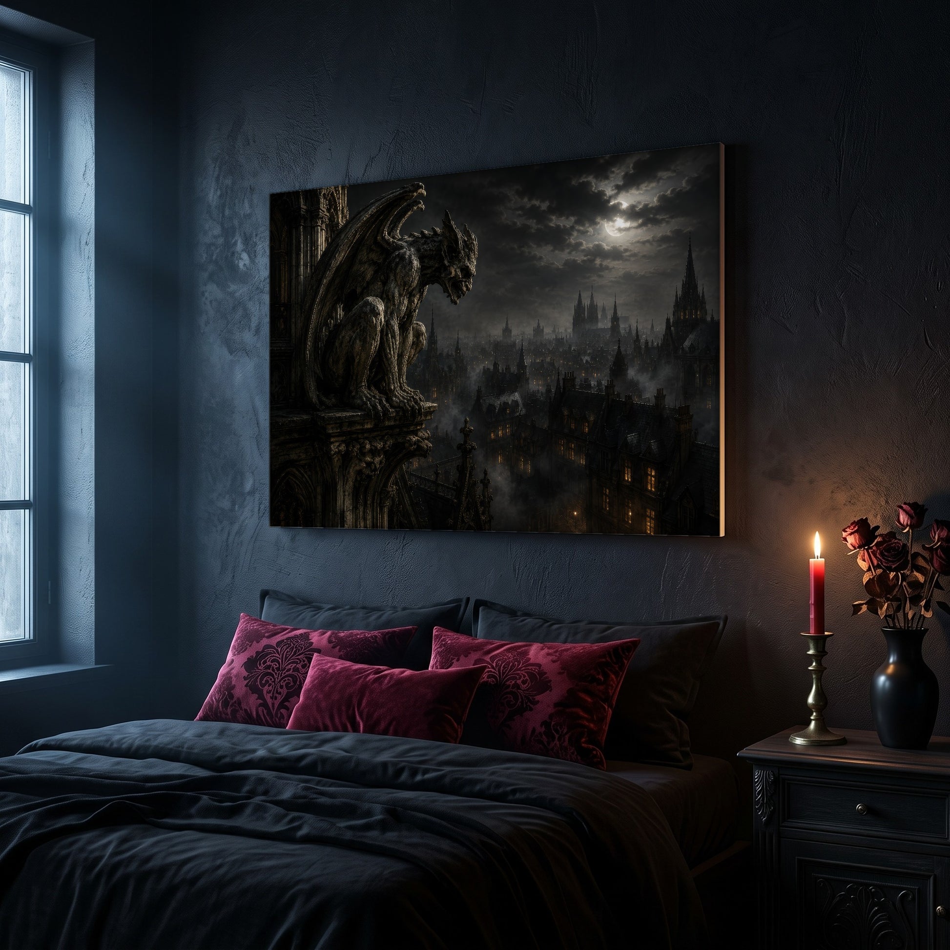 Nightwatch gargoyle canvas hanging on a dark navy wall above a bed in a gothic bedroom, with magenta and burgundy damask velvet cushions against dark bedding, a tall window to the left, and a nightstand holding a lit red taper candle in a brass holder and a black vase of dried roses.
