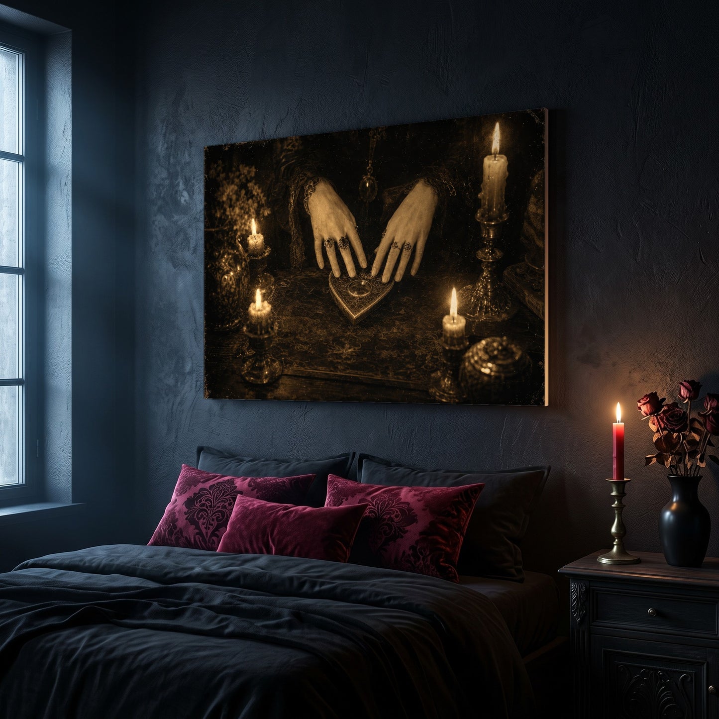 Midnight Communion canvas hanging on a dark navy wall in a gothic bedroom, above a bed with burgundy velvet pillows and charcoal bedding, beside an arched leaded window and a wooden nightstand holding a lit red taper candle in a brass holder and a black vase of dried roses.