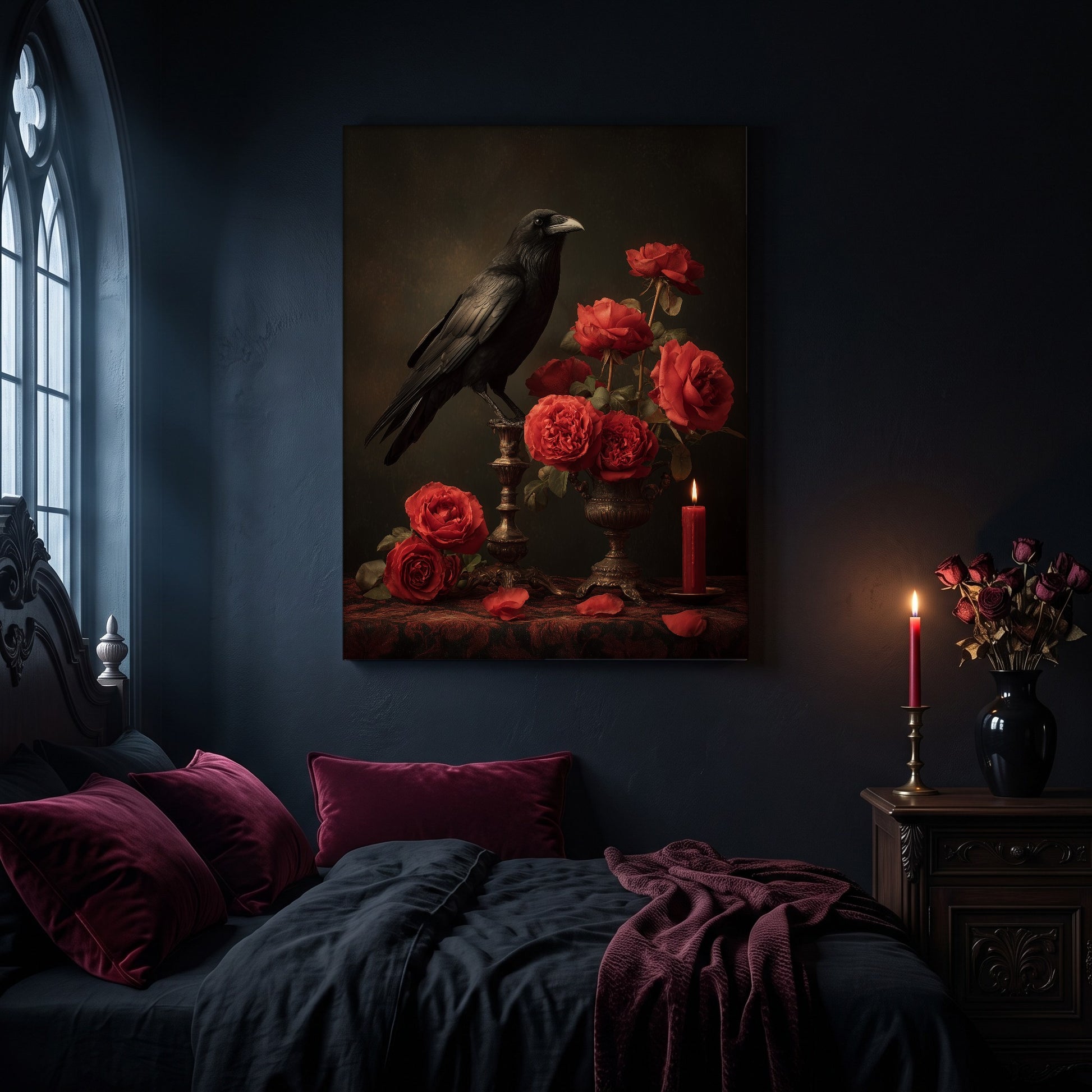 Vermilion still life canvas hanging on a dark navy wall in a gothic bedroom, above a bed with burgundy velvet pillows and charcoal bedding, beside an arched leaded window and a wooden nightstand holding a lit red taper candle in a brass holder and a black vase of dried roses.