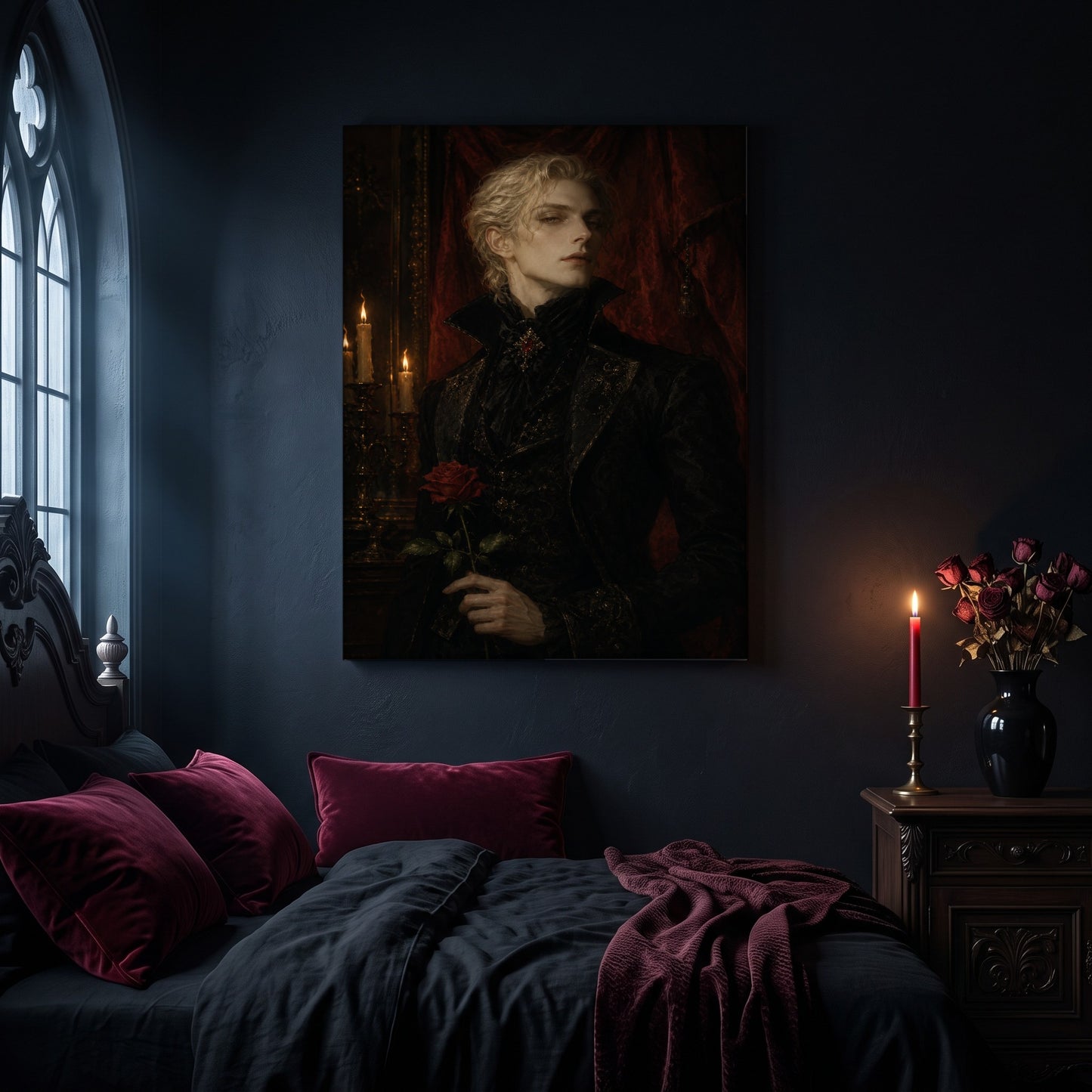 The Aesthete portrait canvas hanging on a dark navy wall in a gothic bedroom, above a bed with burgundy velvet pillows and charcoal bedding, beside an arched leaded window and a wooden nightstand holding a lit red taper candle in a brass holder and a black vase of dried roses.