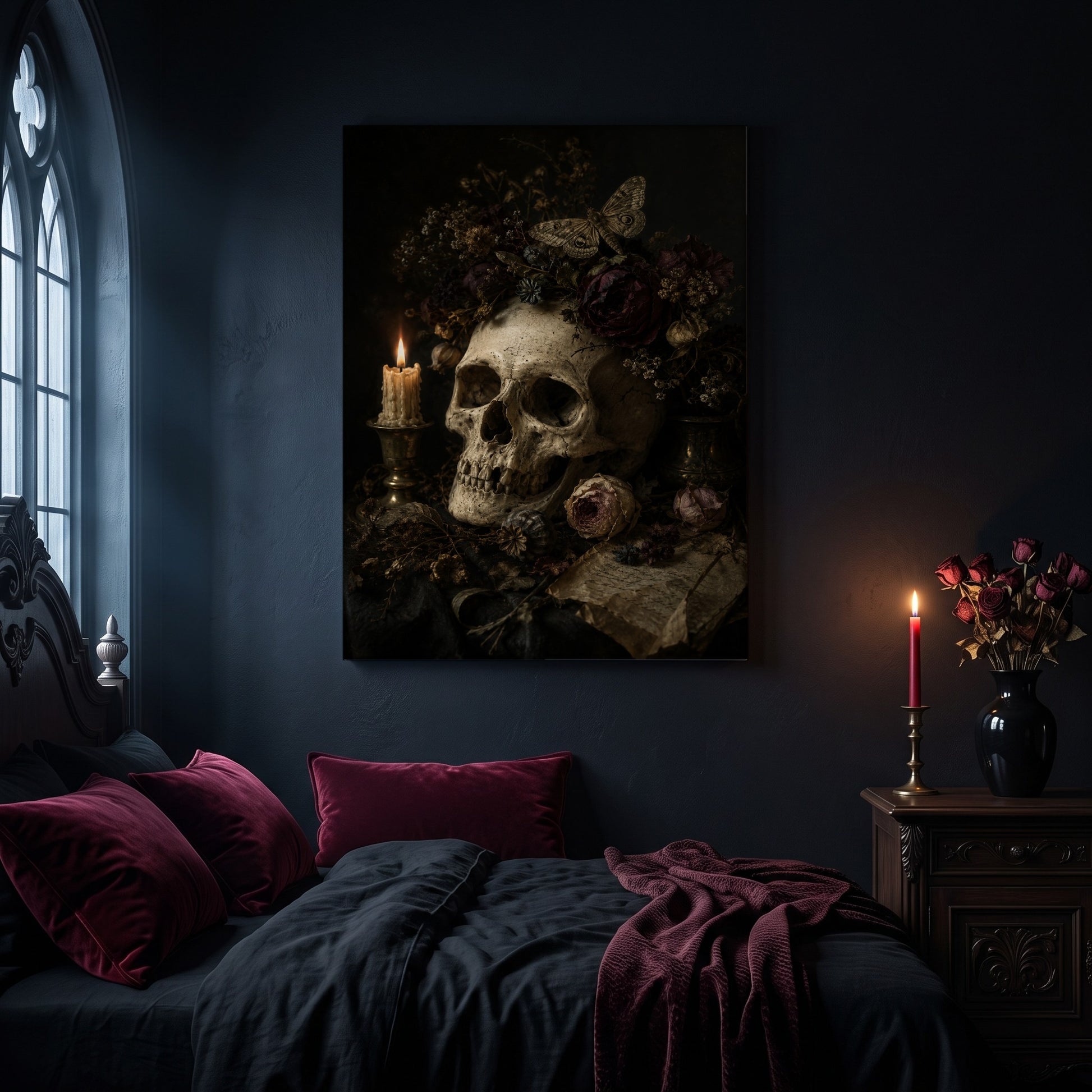 Requiem vanitas canvas hanging on a dark navy wall in a gothic bedroom, above a bed with burgundy velvet pillows and charcoal bedding, beside an arched leaded window and a wooden nightstand holding a lit red taper candle in a brass holder and a black vase of dried roses.