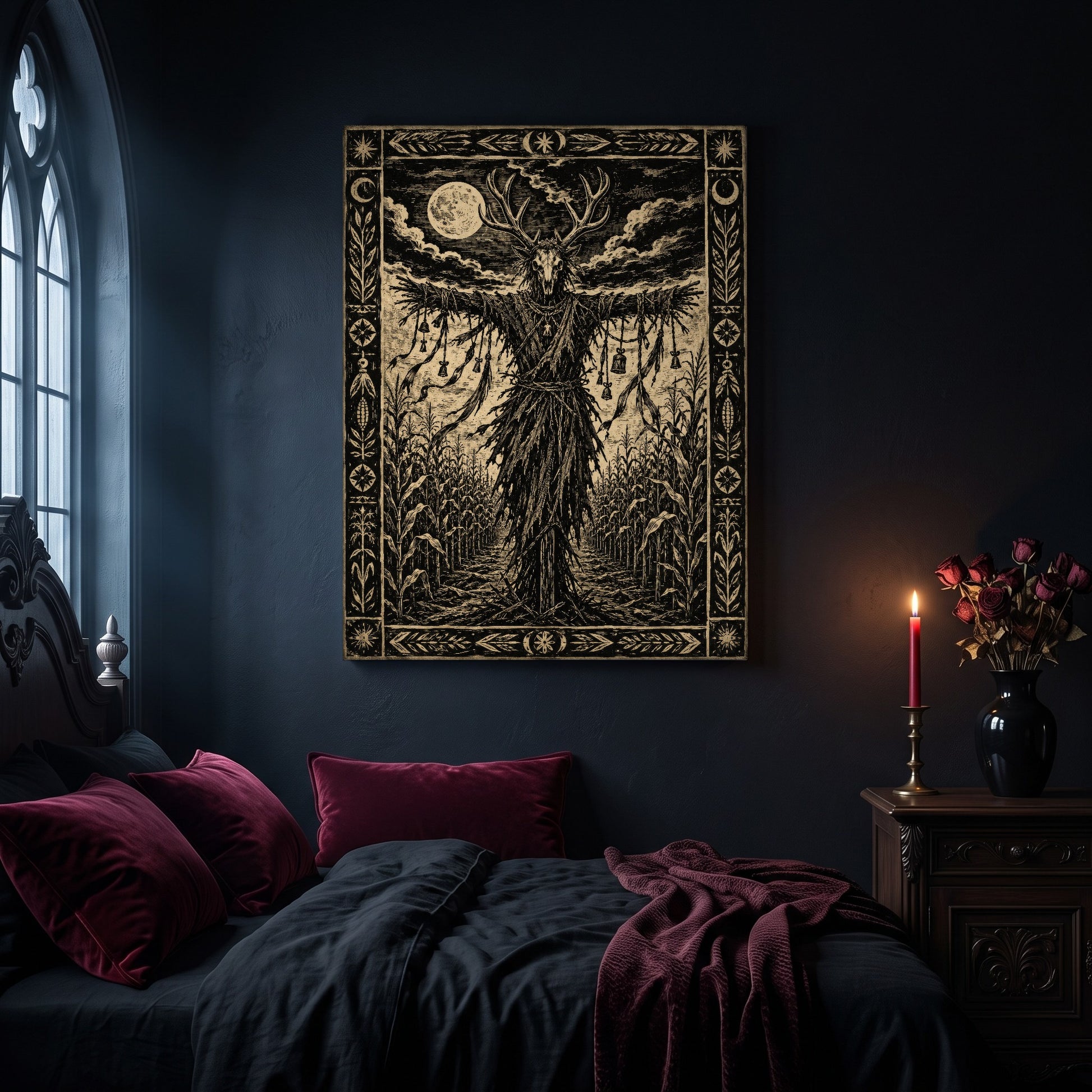 The Corn Sentinel canvas hanging on a dark navy wall in a gothic bedroom, above a bed with burgundy velvet pillows and charcoal bedding, beside an arched leaded window and a nightstand holding a lit red taper candle and a black vase of dried roses.