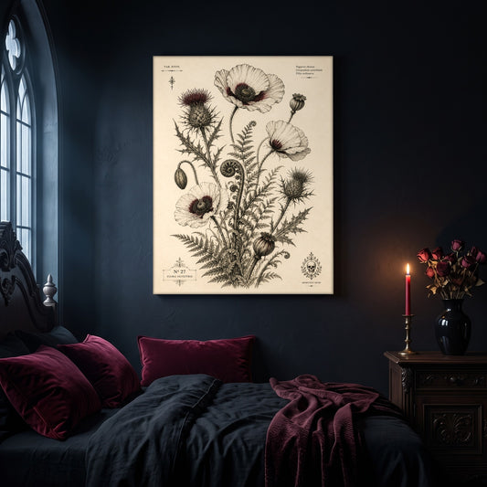 The Wild Folio botanical canvas hanging on a dark navy wall in a gothic bedroom, above a bed with burgundy velvet pillows and charcoal bedding, beside an arched leaded window and a wooden nightstand holding a lit red taper candle in a brass holder and a black vase of dried roses.