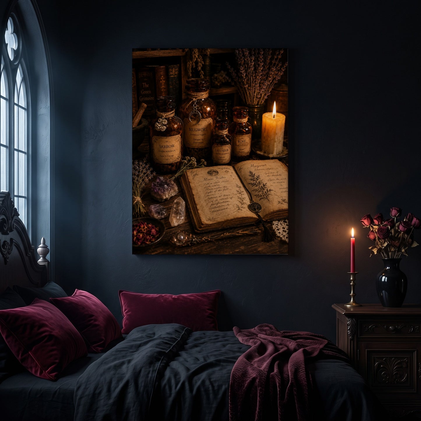 The Still Room apothecary canvas hanging on a dark navy wall in a gothic bedroom, above a bed with burgundy velvet pillows and charcoal bedding, beside an arched leaded window and a wooden nightstand holding a lit red taper candle in a brass holder and a black vase of dried roses.