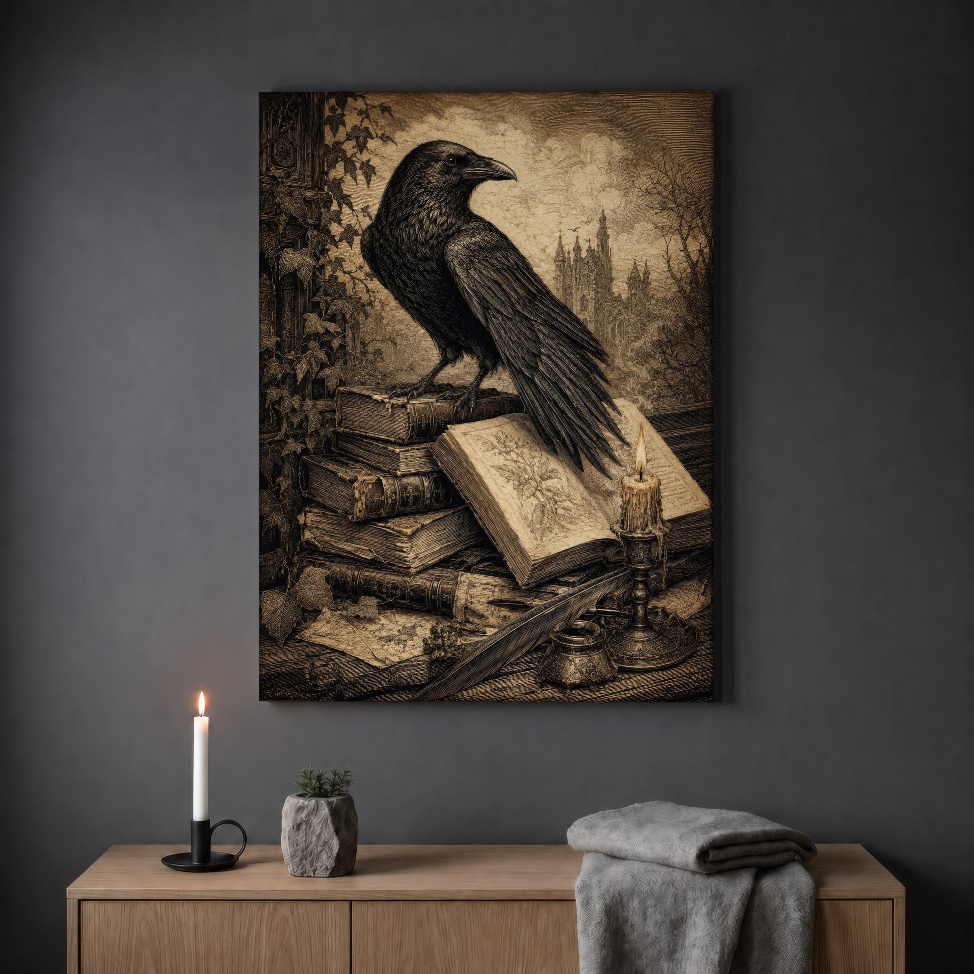 Muninn's Vigil candlelit print hanging on a plain grey wall above a light oak sideboard, styled with a lit white taper candle in a black holder, a small stone pot of greenery and a folded grey throw.
