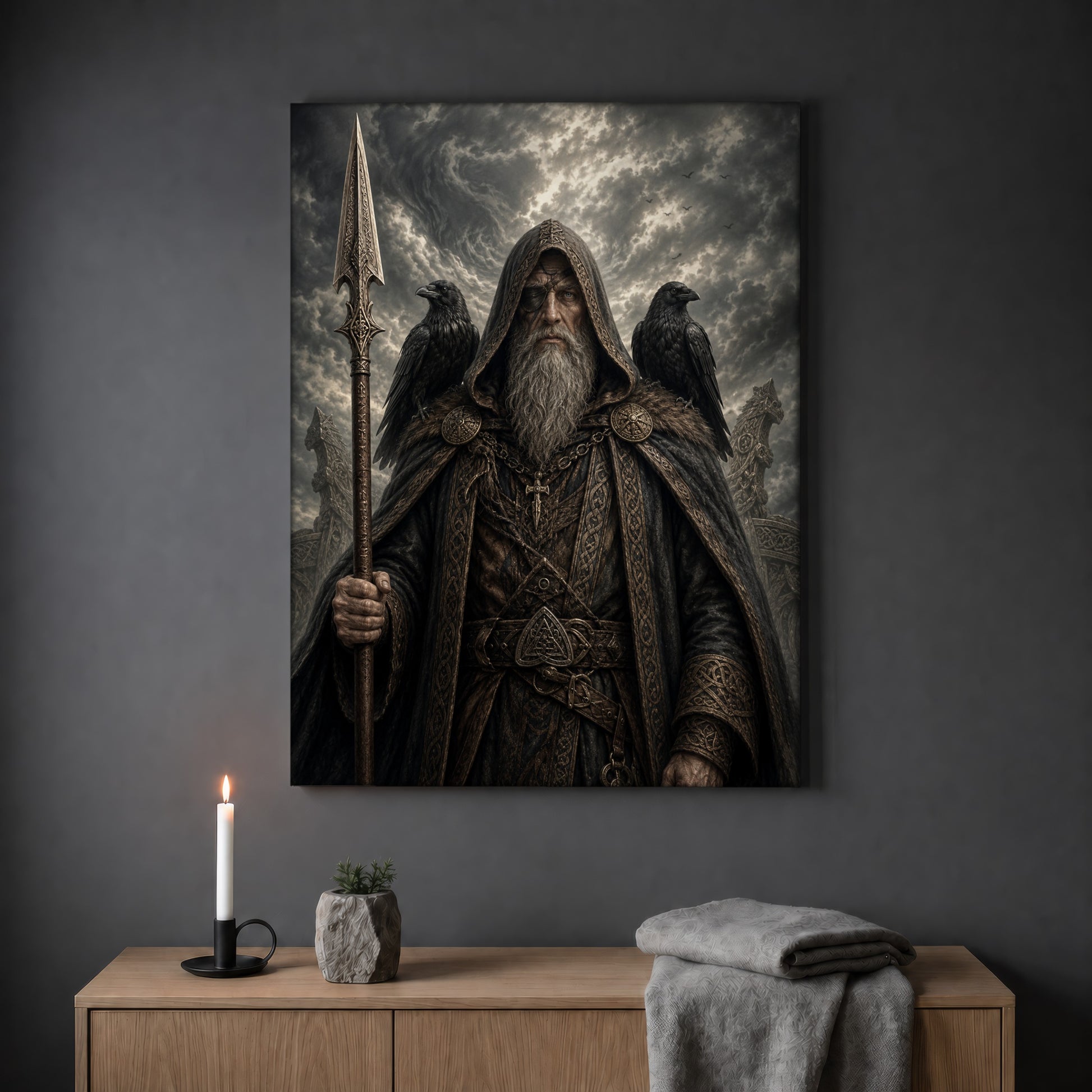 Gungnir spear print hanging on a plain grey wall above a light oak sideboard, styled with a lit white taper candle in a black holder, a small stone pot of greenery and a folded grey throw.