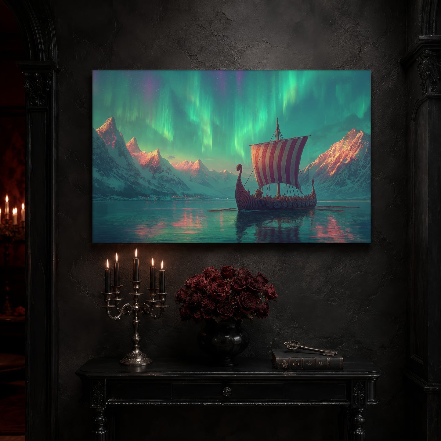 Vinland longship canvas on a near-black wall above a carved black console table, with a five-arm silver candelabra of lit black tapers, a black vase of deep red roses, and an antique key resting on a leather-bound book.