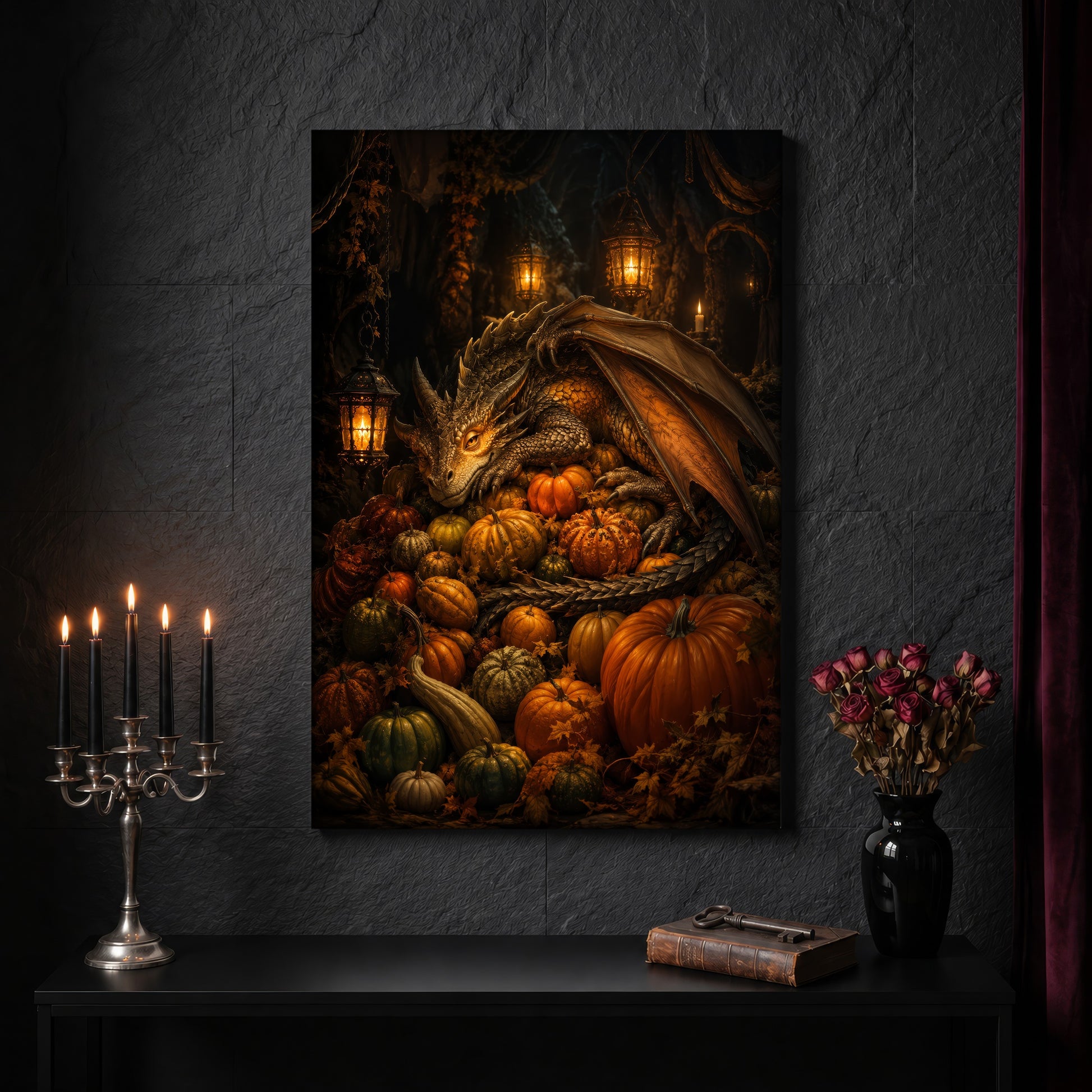 The Pumpkin Den canvas on a dark slate stone wall above a black console table, with a five-arm silver candelabra of lit black tapers, an antique iron key resting on a worn leather book, and a black vase of dried roses beside a burgundy velvet curtain.