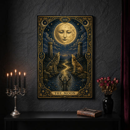 La Lune gilded tarot canvas on a dark slate stone wall above a black console table, with a five-arm silver candelabra of lit black tapers, an antique iron key resting on a worn leather book, and a black vase of dried roses beside a burgundy velvet curtain.
