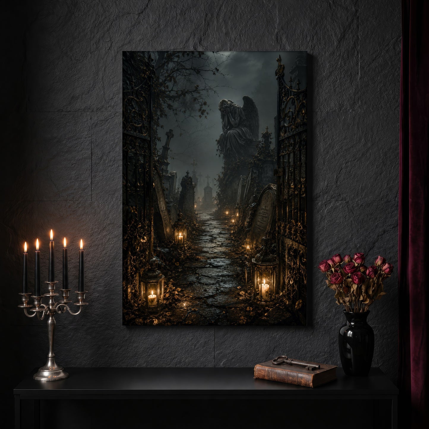 The Lychgate angel canvas on a dark slate stone wall above a black console table, with a five-arm silver candelabra of lit black tapers, an antique iron key resting on a worn leather book, and a black vase of dried roses beside a burgundy velvet curtain.
