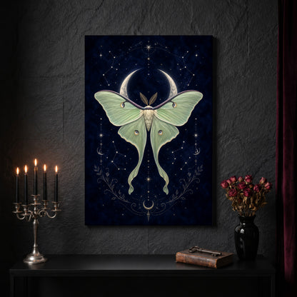 Verdigris celestial canvas on a dark slate stone wall above a black console table, with a five-arm silver candelabra of lit black tapers, an antique iron key resting on a worn leather book, and a black vase of dried roses beside a burgundy velvet curtain.