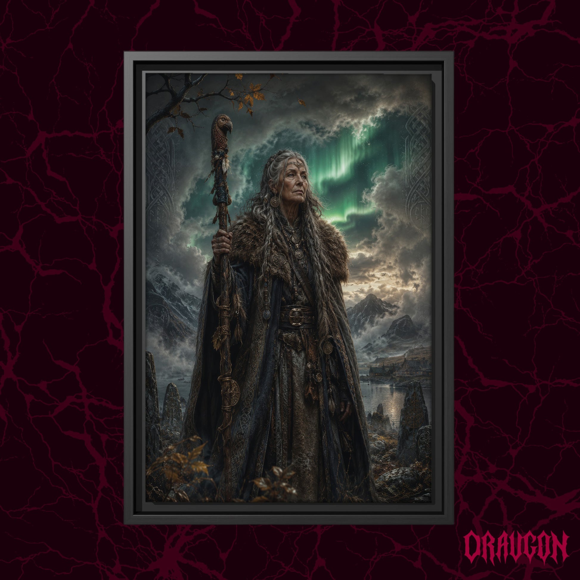 Spákona shown as a black framed canvas against a deep red marbled backdrop with the Draugon wordmark in the lower corner, displaying the elder seeress with her staff among the standing stones and aurora.