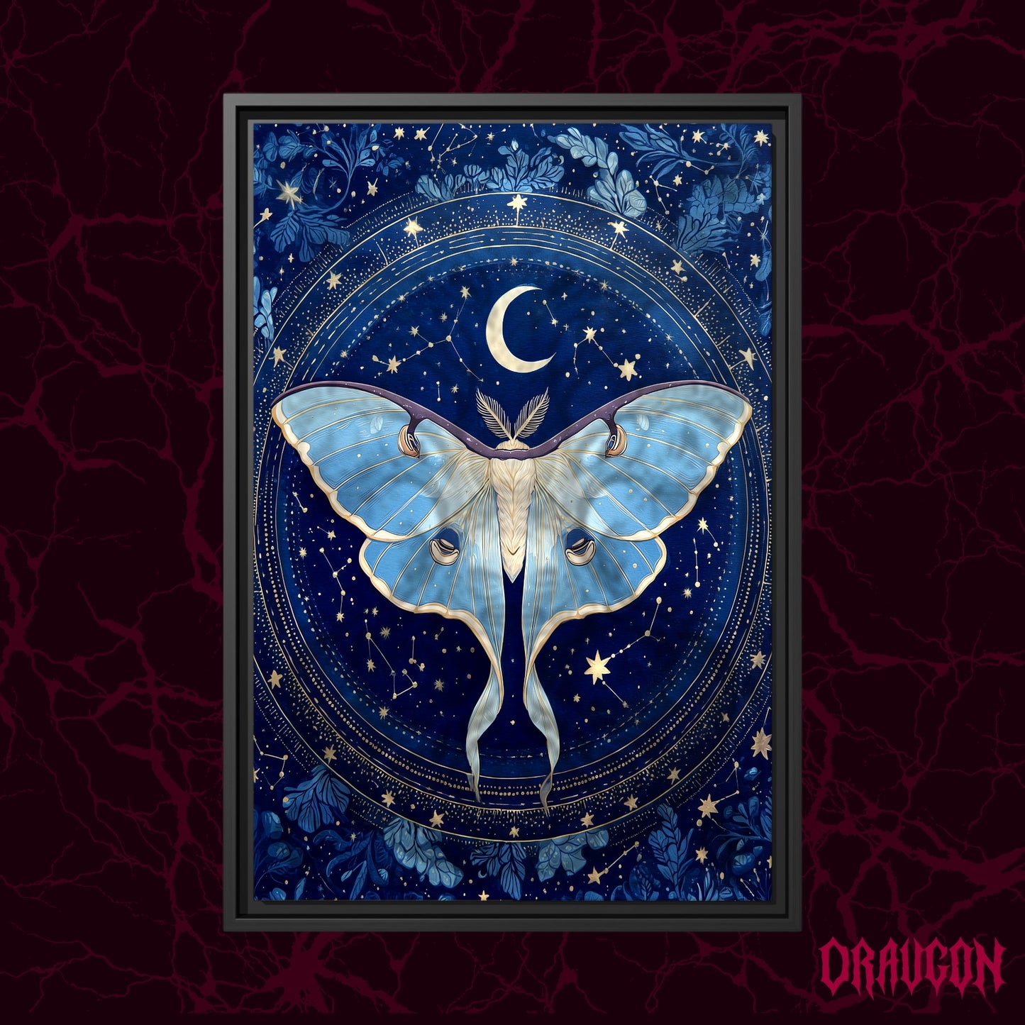 The Blue Hour shown as a black framed canvas against a deep red marbled backdrop with the Draugon wordmark in the lower corner, displaying the full cobalt and gold moth and constellation wheel.