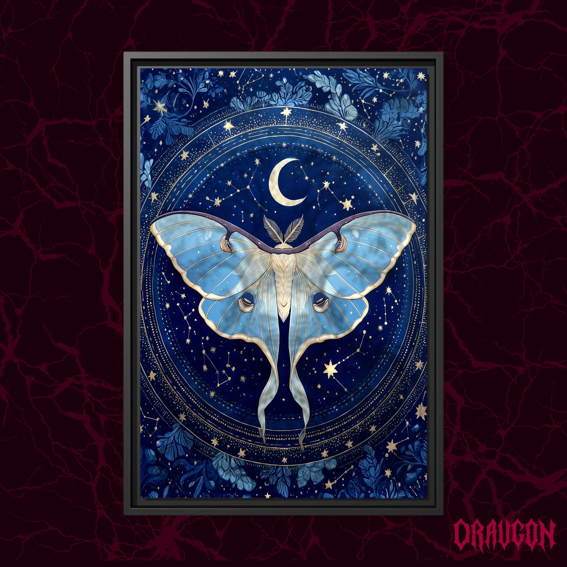 The Blue Hour shown as a black framed canvas against a deep red marbled backdrop with the Draugon wordmark in the lower corner, displaying the full cobalt and gold moth and constellation wheel.