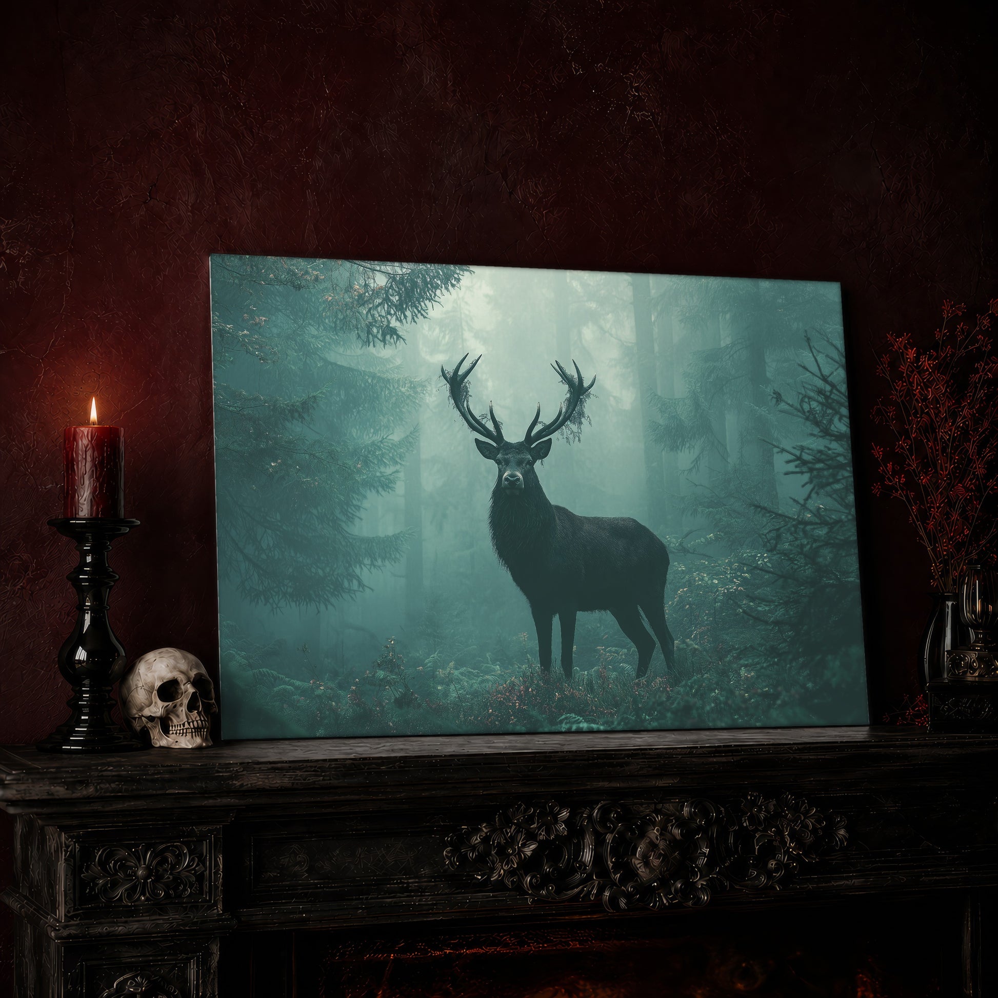 The Green Chapel stag canvas leaning on a dark carved mantel against an oxblood wall, beside a lit dark red pillar candle in a black candlestick, a bone-coloured skull, and a vase of red berry sprigs with a brass lantern to the right.
