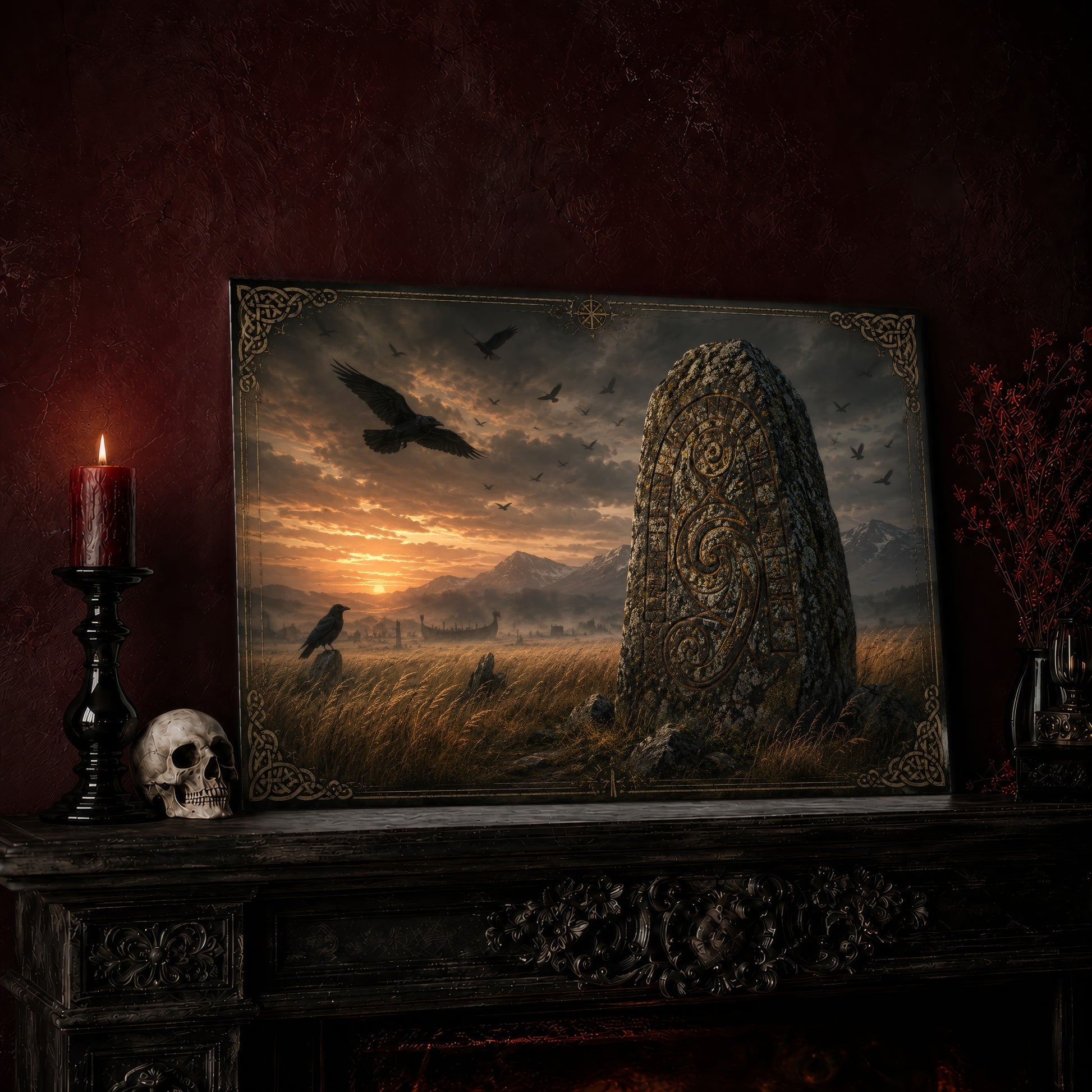 The Harvest Stone print leaning on a dark carved mantel against an oxblood wall, beside a lit dark red pillar candle in a black candlestick, a bone-coloured skull, and a vase of red berry sprigs with a brass lantern to the right.