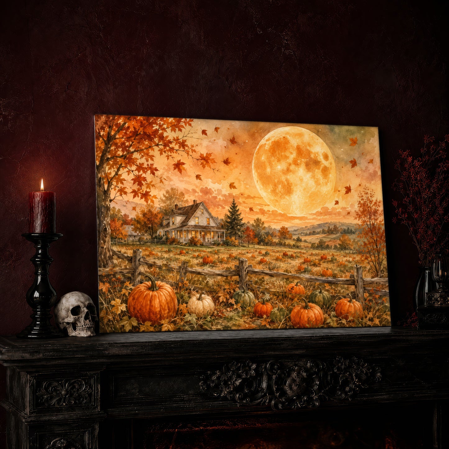 Homestead Moonrise canvas leaning on a dark mantel beside a lit candle in a black holder and a human skull, in a deep oxblood room with a bookshelf and a black vase of red berry sprigs nearby.