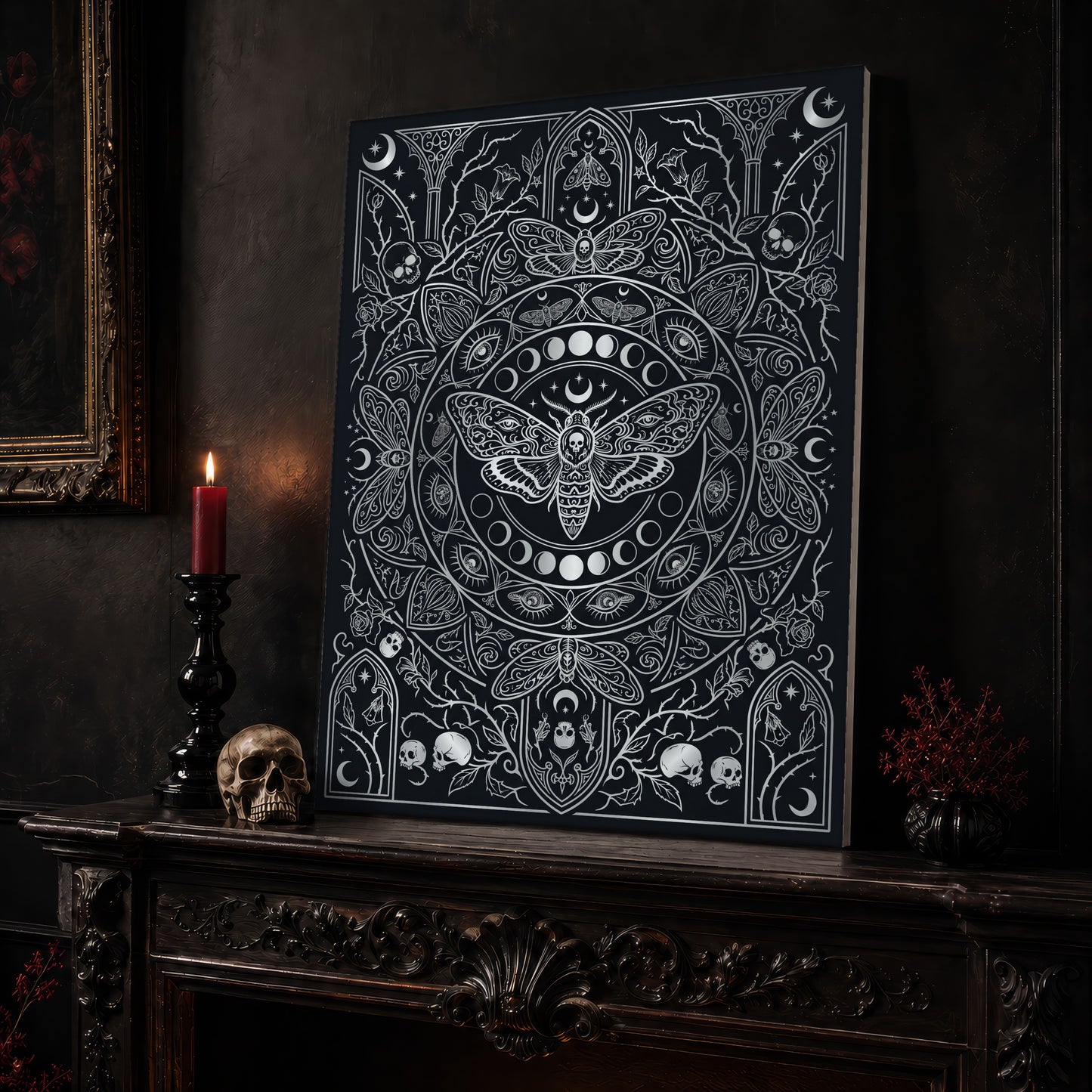 Vanitas death moth canvas leaning on a dark carved mantel beside a lit dark red taper in a black candlestick, a bone-coloured skull, and a small black vase of red berry sprigs, with a gilt-framed painting on the wall alongside.