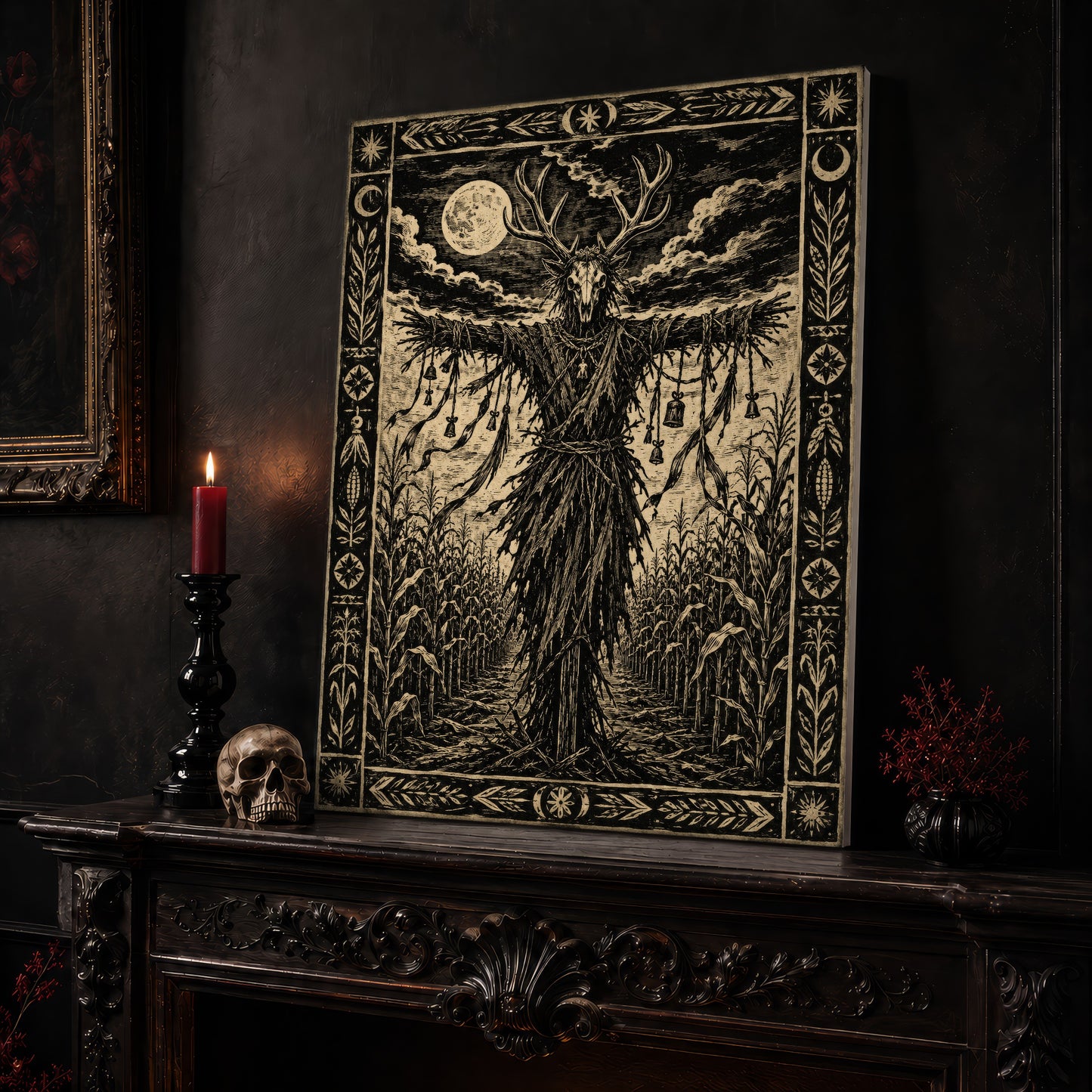 The Corn Sentinel print leaning on a dark carved mantel beside a lit dark red taper in a black candlestick, a pale skull, and a small black vase of red berry sprigs, with a gilt-framed painting on the wall alongside.