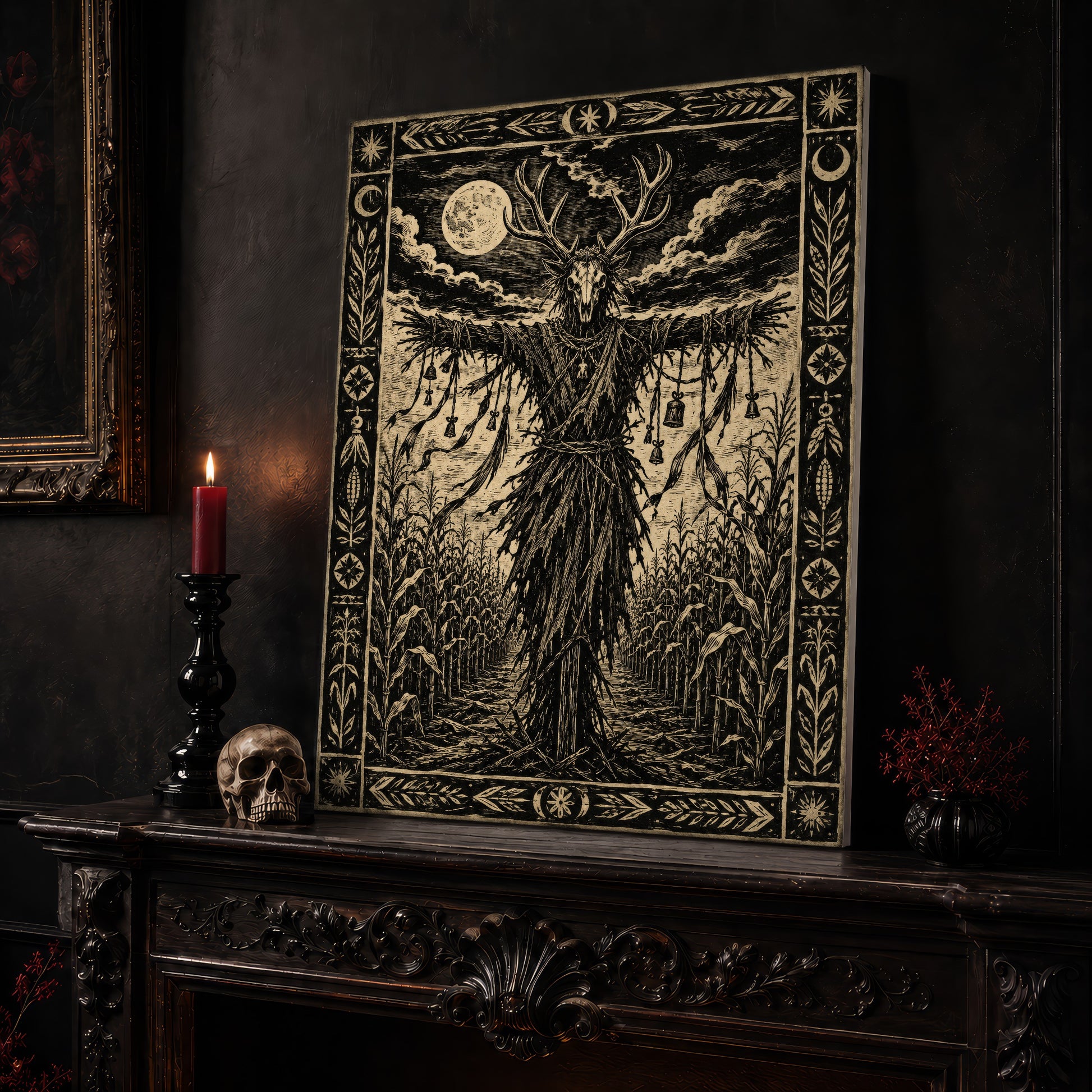 The Corn Sentinel print leaning on a dark carved mantel beside a lit dark red taper in a black candlestick, a pale skull, and a small black vase of red berry sprigs, with a gilt-framed painting on the wall alongside.