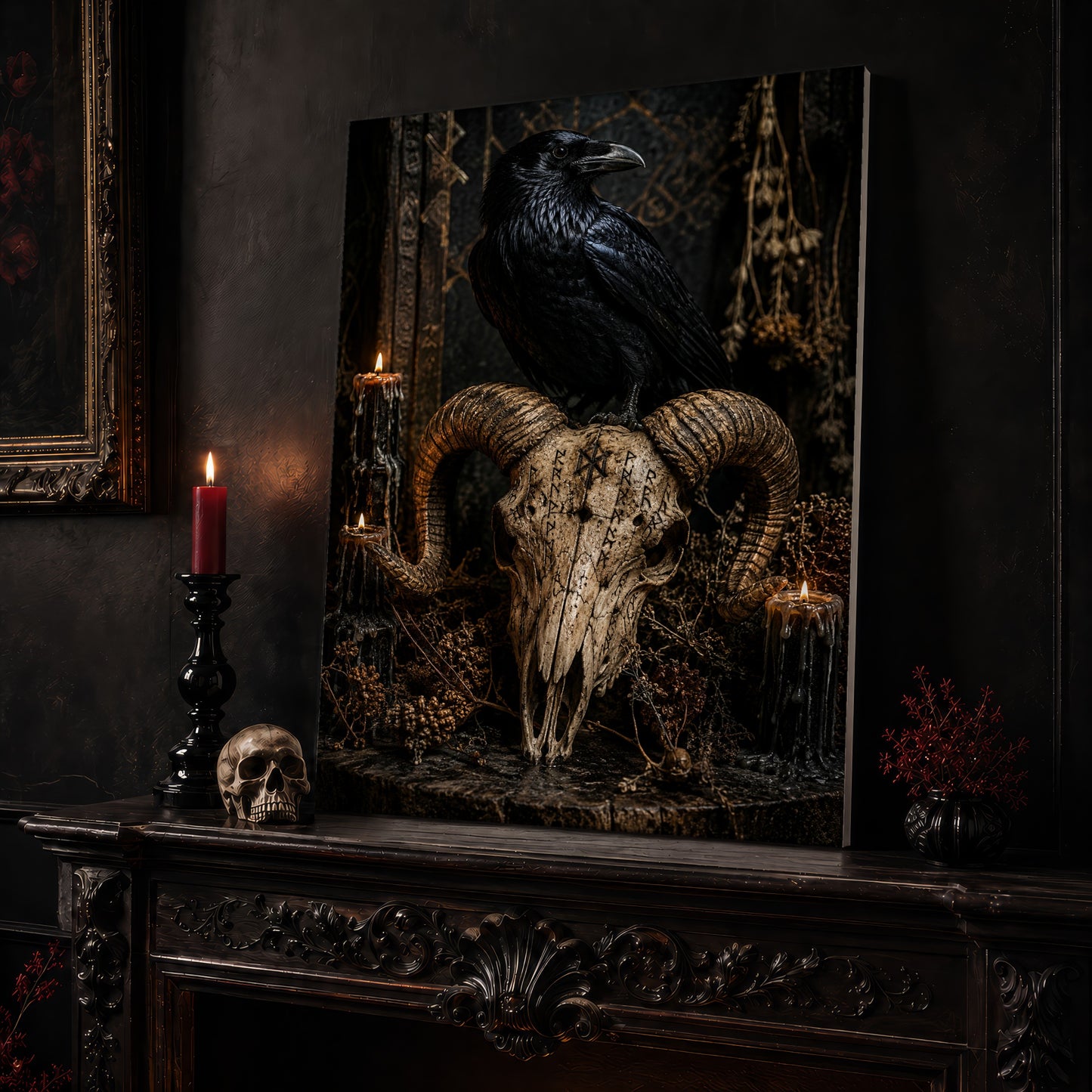 Valravn altar canvas leaning on a dark carved mantel beside a lit dark red taper in a black candlestick, a bone-coloured skull, and a small black vase of red berry sprigs, with a gilt-framed painting on the wall alongside.
