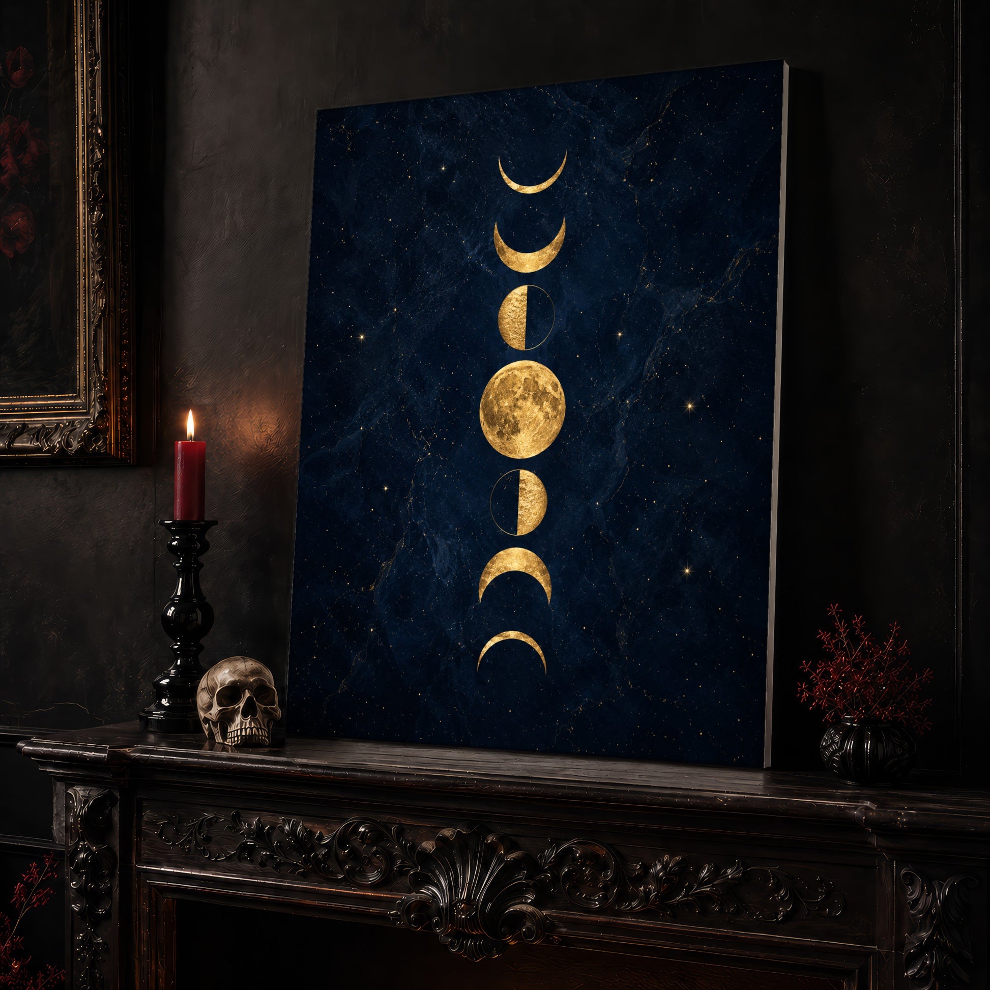 Lunarium lunar canvas leaning on a dark carved mantel beside a lit dark red taper in a black candlestick, a bone-coloured skull, and a small black vase of red berry sprigs, with a gilt-framed painting on the wall alongside.