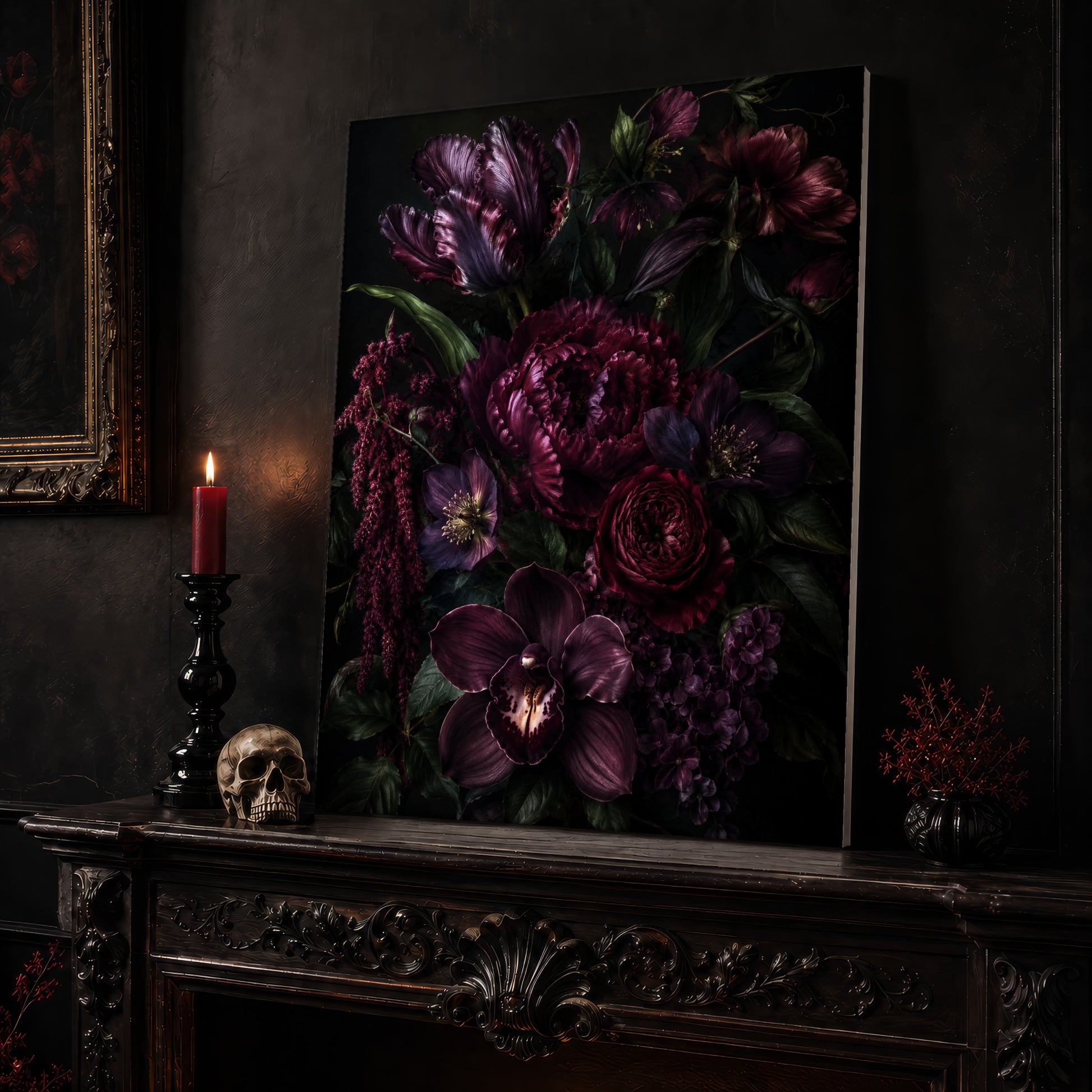 Umbra floral canvas leaning on a dark carved mantel beside a lit dark red taper in a black candlestick, a bone-coloured skull, and a small black vase of red berry sprigs, with a gilt-framed painting on the wall alongside.
