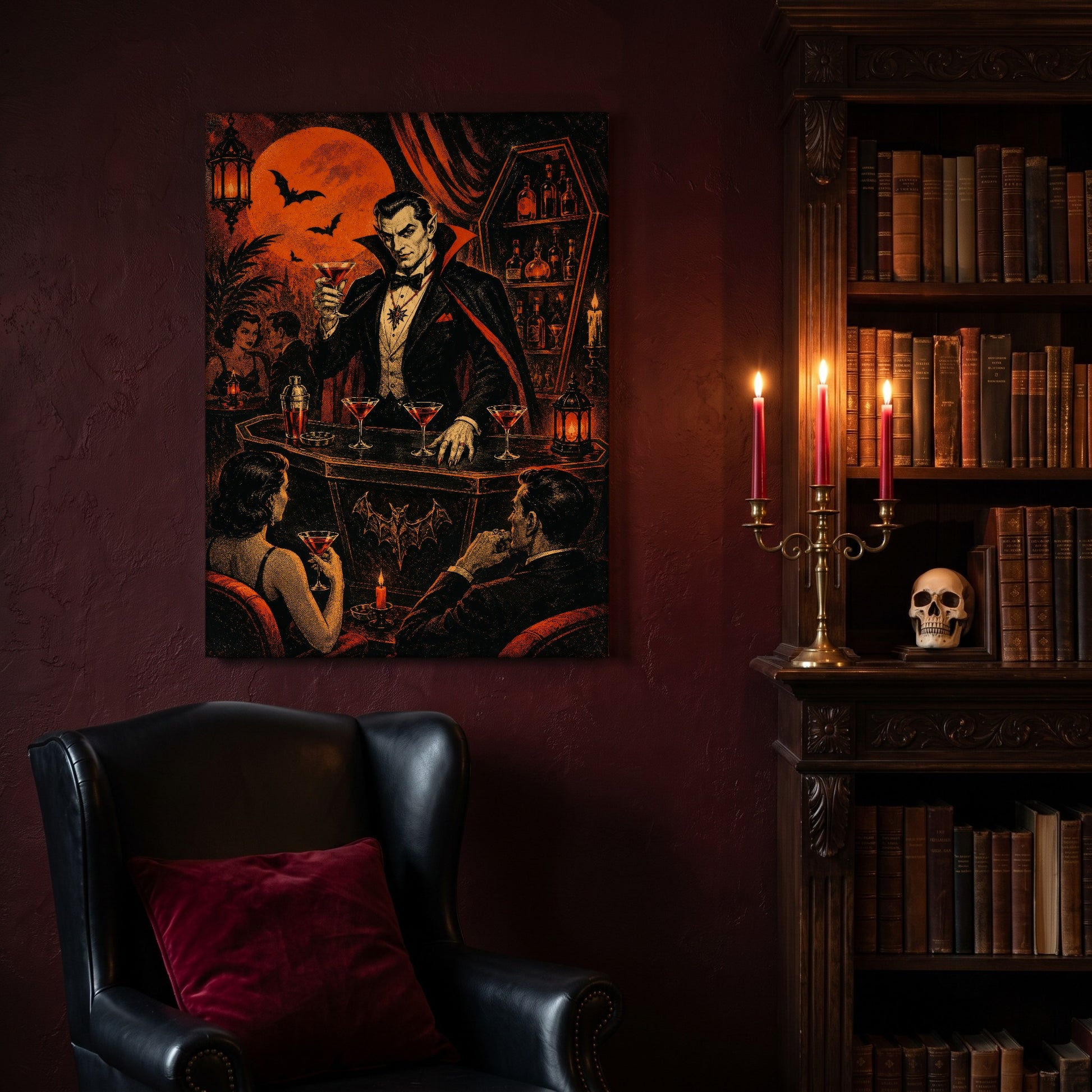 Shaken Not Staked vampire bar canvas hanging on a deep oxblood wall in a reading nook, above a black leather wingback chair with a red velvet cushion, beside a carved bookcase of antique books, a brass candelabra of lit red tapers and a human skull on the shelf.