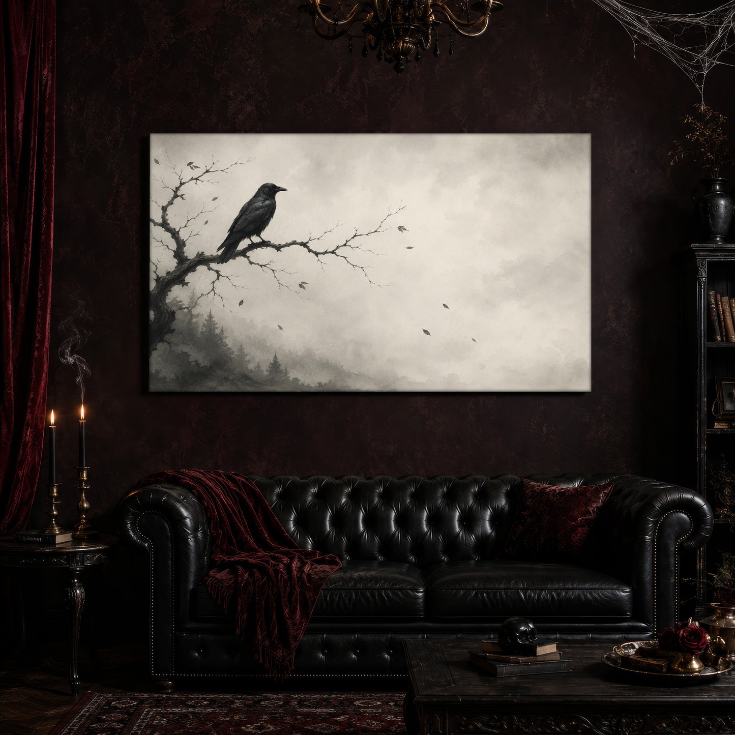 Hollow Morning crow canvas hanging above a black tufted Chesterfield sofa draped with a red fringed velvet throw, in a cobwebbed oxblood parlour with a brass chandelier, lit black tapers, red velvet curtains and a patterned rug.