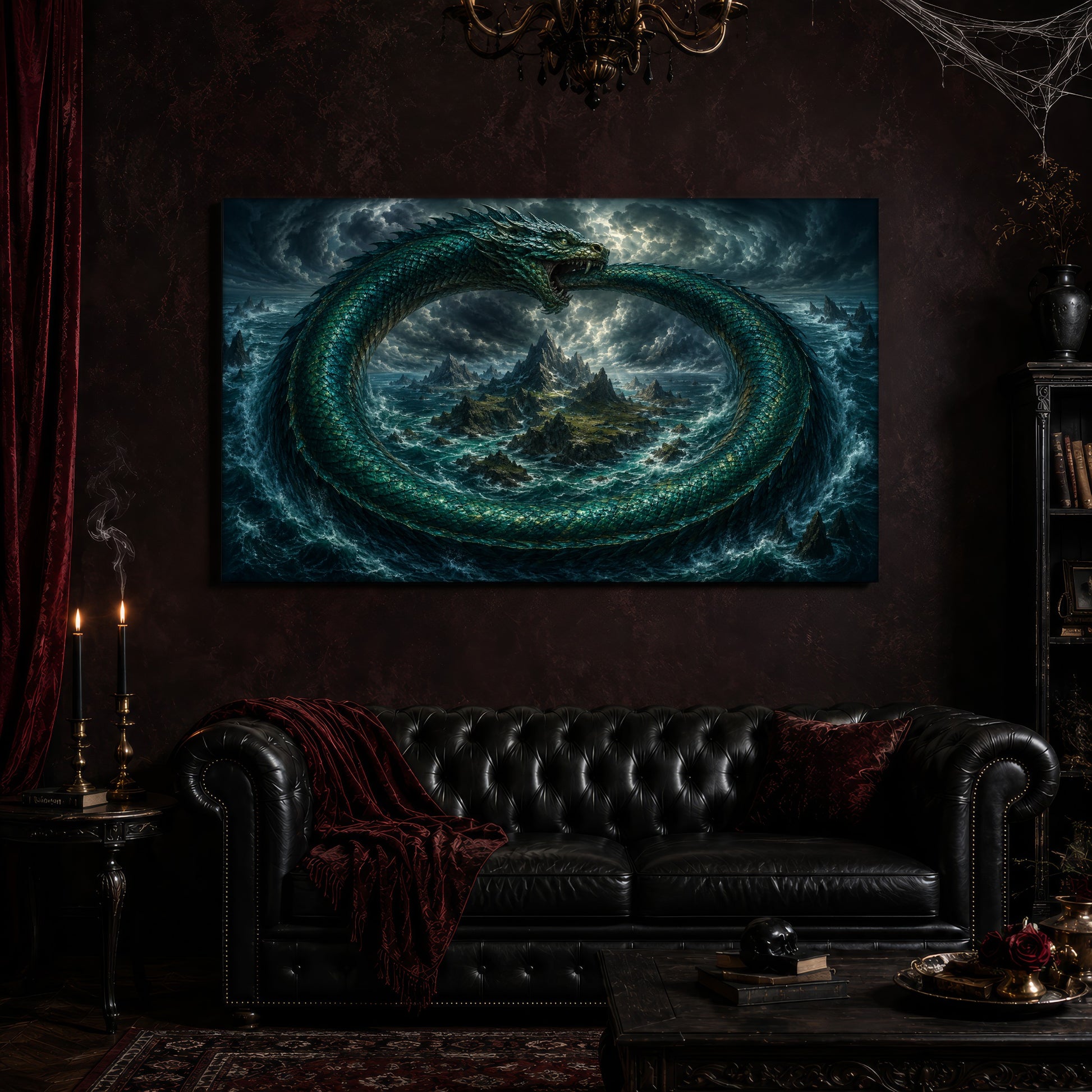 Jörmungandr canvas hanging above a black tufted Chesterfield sofa draped with a red fringed velvet throw, in a cobwebbed oxblood parlour with a brass chandelier, lit black tapers, red velvet curtains and a patterned rug.