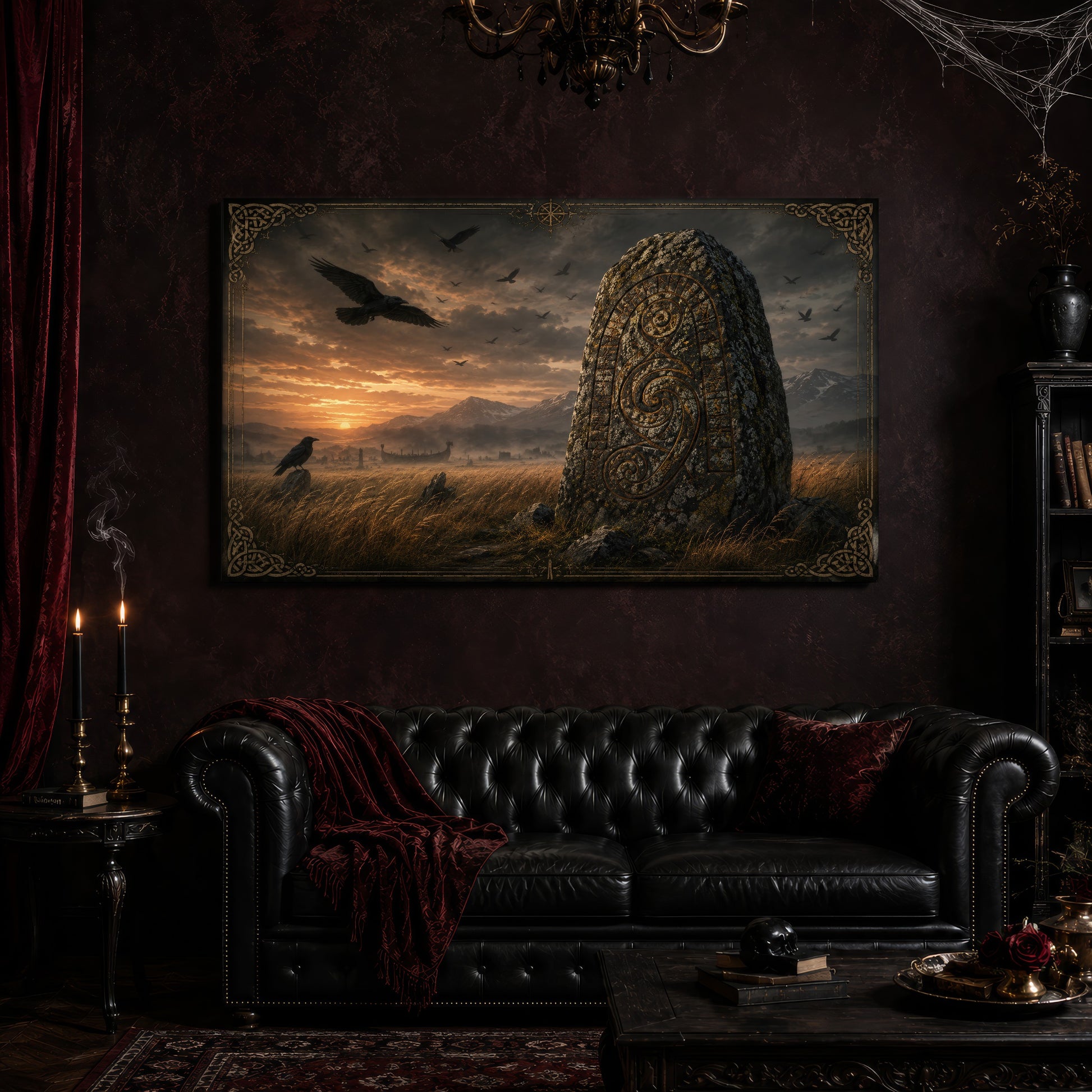 The Harvest Stone canvas hanging above a black tufted Chesterfield sofa draped with a red fringed velvet throw, in a cobwebbed oxblood parlour with a brass chandelier, lit black tapers, red velvet curtains and a patterned rug.