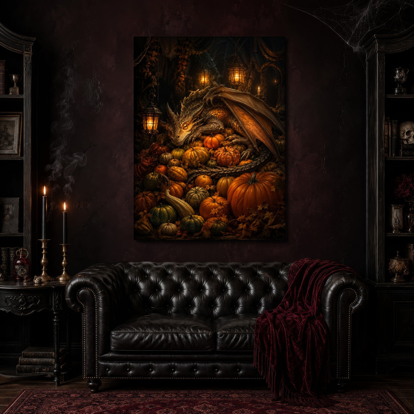 The Pumpkin Den canvas hanging above a black tufted Chesterfield loveseat draped with a red fringed velvet throw, in a cobwebbed oxblood parlour with brass candlesticks, dark bookshelves and a patterned red rug.