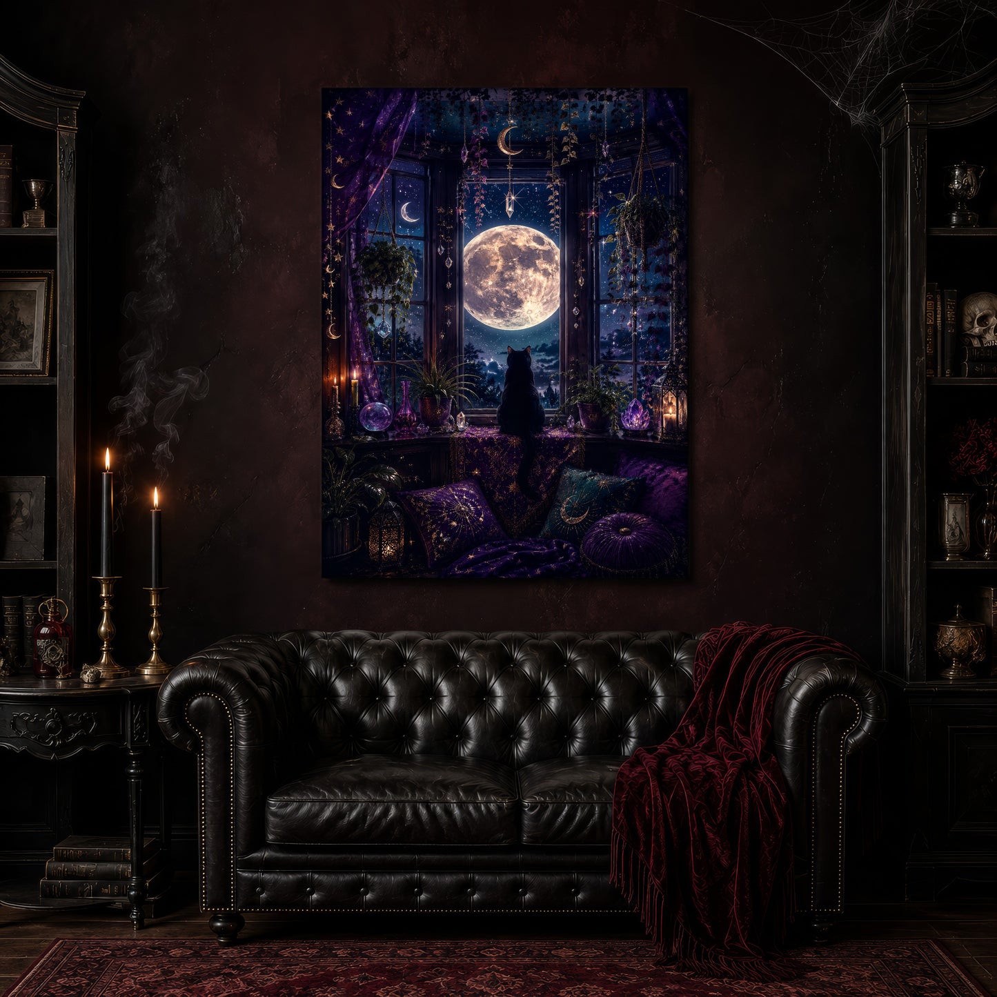 Witch's Window canvas hanging above a black tufted Chesterfield sofa draped with a red fringed velvet throw, in a cobwebbed oxblood parlour with brass candlesticks, dark cabinets of books and goblets, and a patterned red rug.