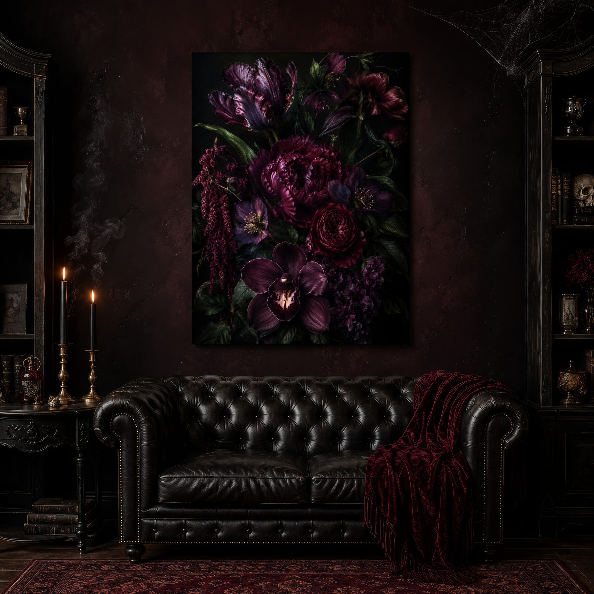 Umbra dark bouquet canvas hanging above a black tufted Chesterfield sofa draped with a red fringed velvet throw, in a cobwebbed oxblood parlour with brass candlesticks, dark cabinets of books and goblets, and a patterned red rug.