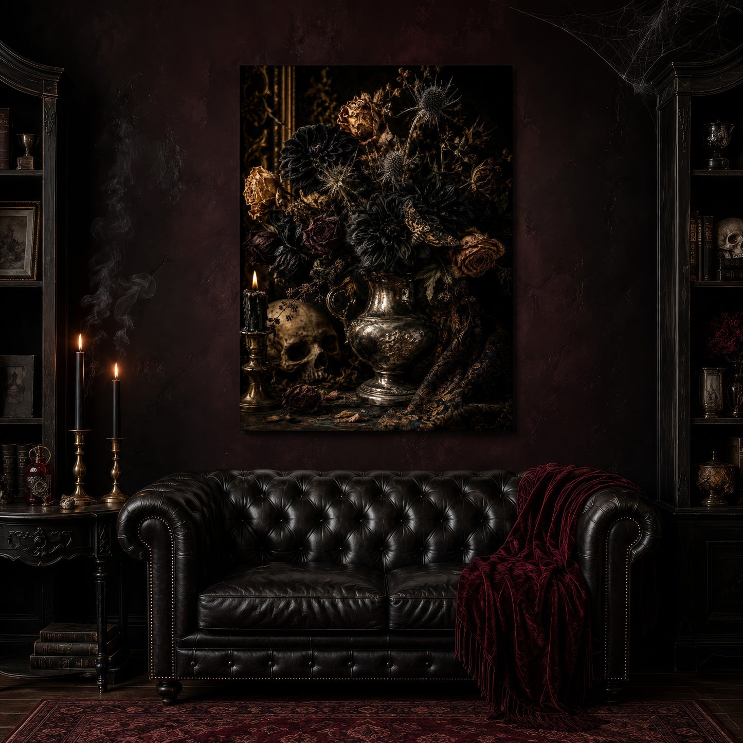 Threnody canvas hanging above a black tufted Chesterfield sofa draped with a red fringed velvet throw, in a cobwebbed oxblood parlour with brass candlesticks, dark cabinets of books and goblets, and a patterned red rug.