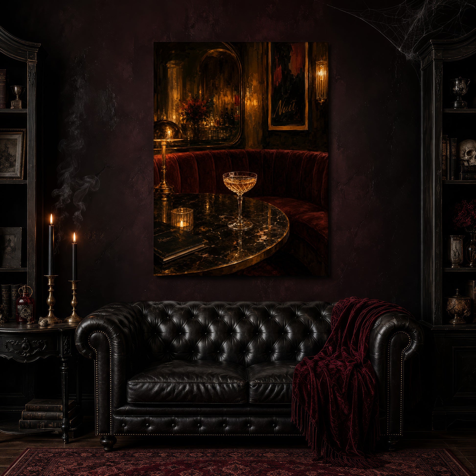 Nuit canvas hanging above a black tufted Chesterfield sofa draped with a red fringed velvet throw, in a cobwebbed oxblood parlour with brass candlesticks, dark cabinets of books and goblets, and a patterned red rug.