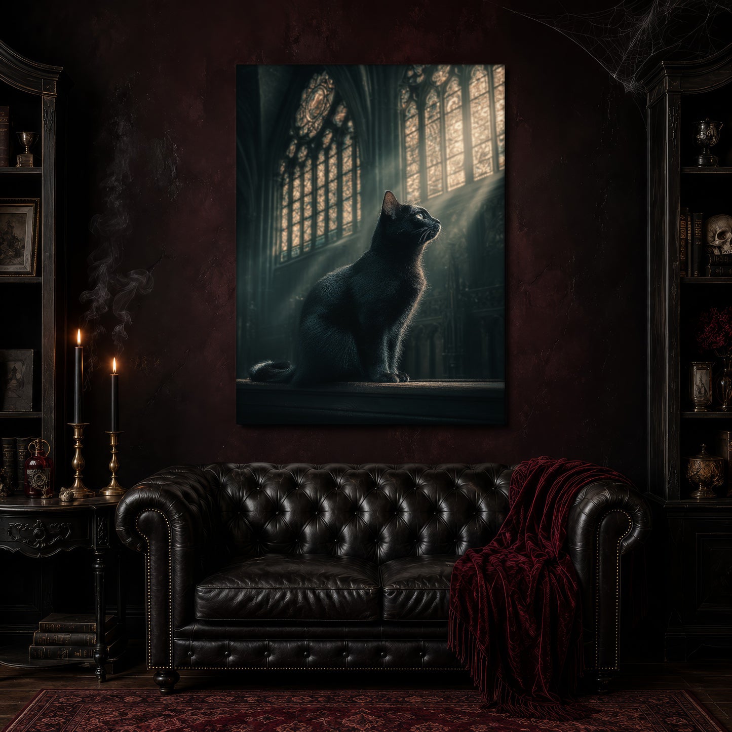 Grimalkin canvas hanging above a black tufted Chesterfield sofa draped with a red fringed velvet throw, in a cobwebbed oxblood parlour with brass candlesticks, dark cabinets of books and goblets, and a patterned red rug.