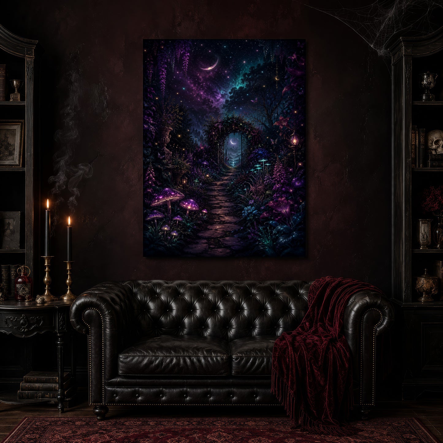 The Midnight Garden canvas hanging above a black tufted Chesterfield sofa draped with a red fringed velvet throw, in a cobwebbed oxblood parlour with brass candlesticks, dark cabinets of books and goblets, and a patterned red rug.
