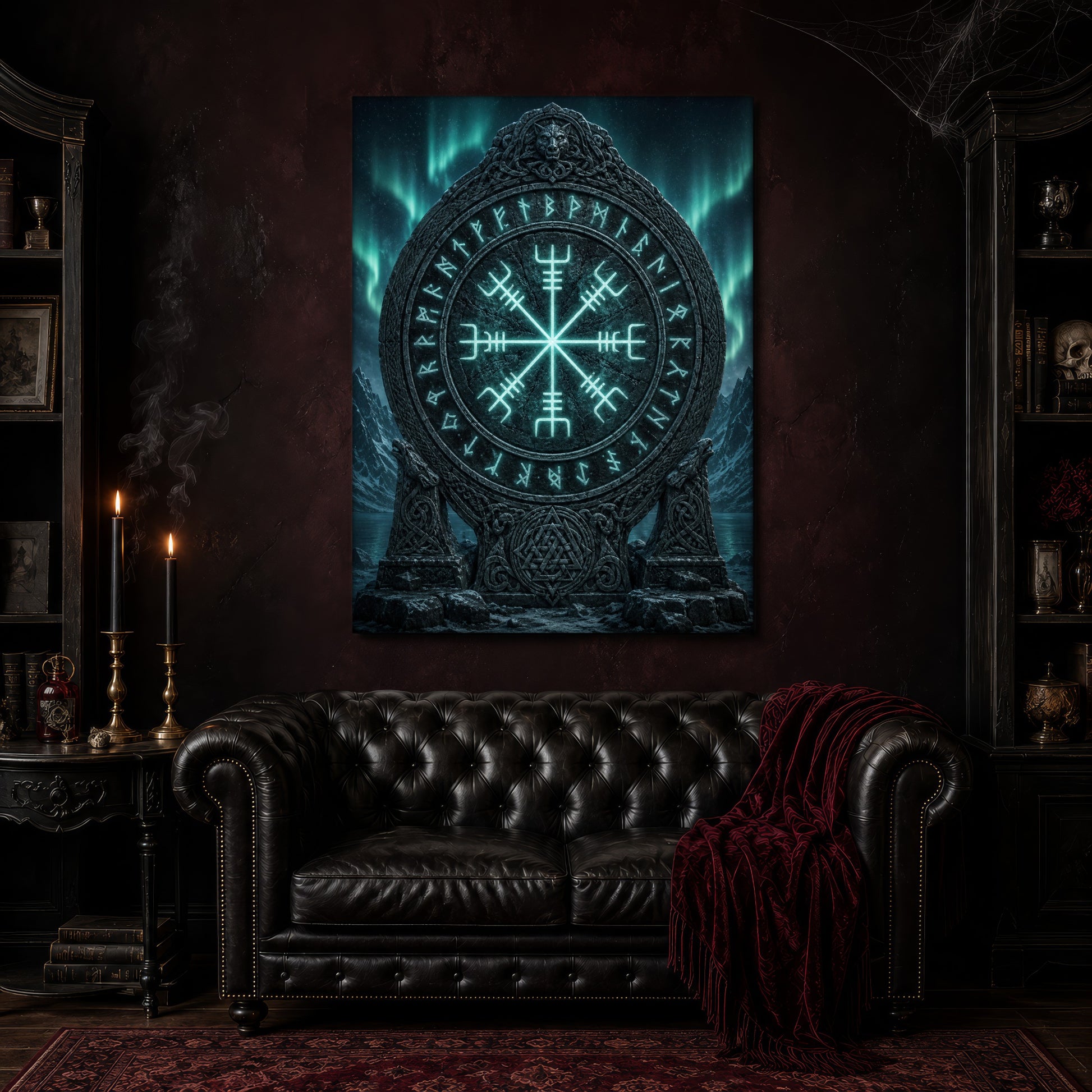 Vegvísir canvas hanging above a black tufted Chesterfield sofa draped with a red fringed velvet throw, in a cobwebbed oxblood parlour with brass candlesticks, dark cabinets of books and goblets, and a patterned red rug.